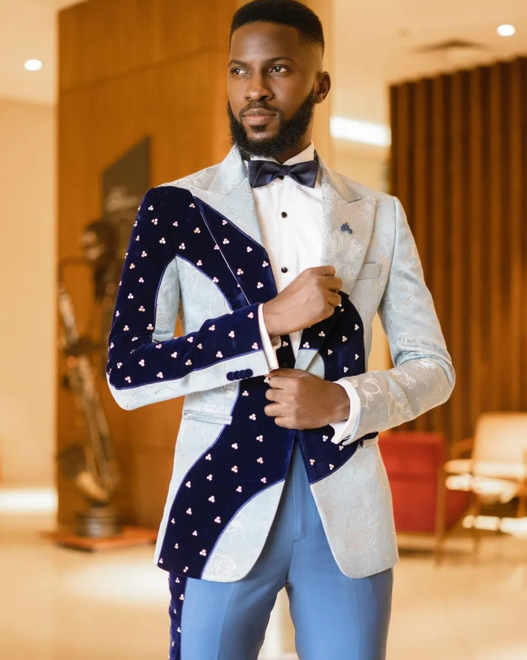 A “Prodigal” dispersed blue and splashed champagne gold metallic jacquard suit