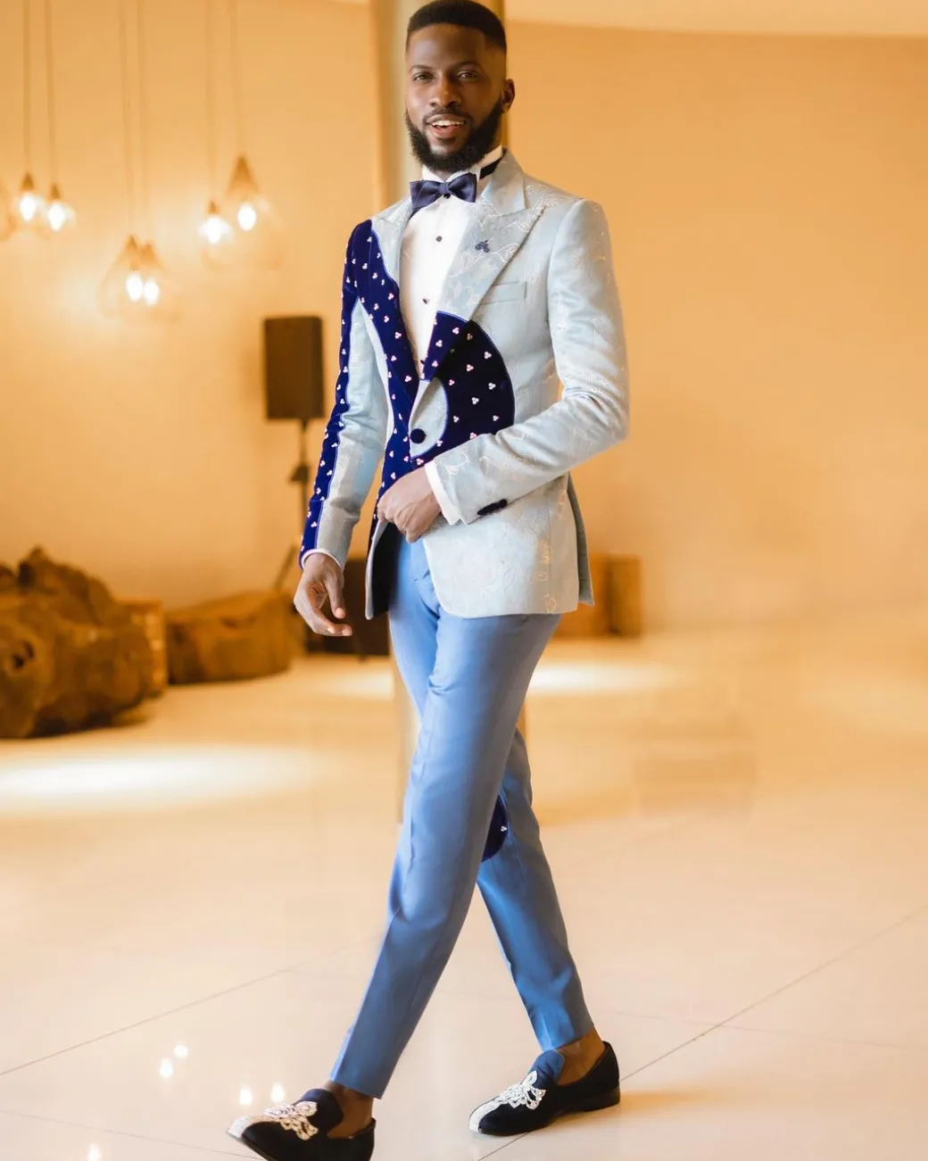 A “Prodigal” dispersed blue and splashed champagne gold metallic jacquard suit
