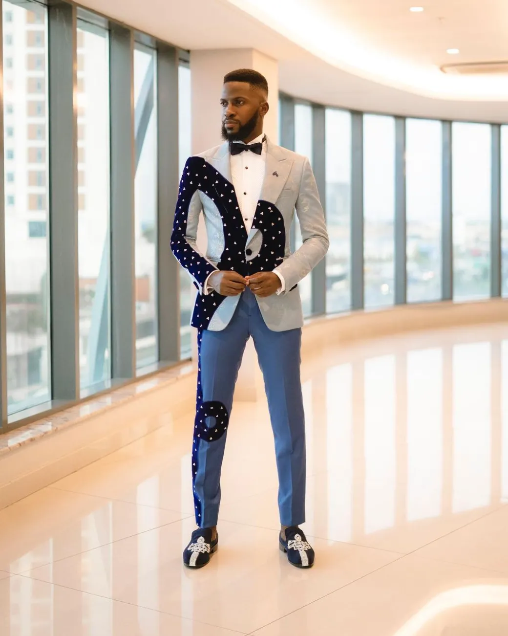 A “Prodigal” dispersed blue and splashed champagne gold metallic jacquard suit