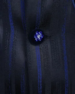 A “Prodigal” lashed midnight blue, admiral blue and splashed black metallic jacquard trench suit
