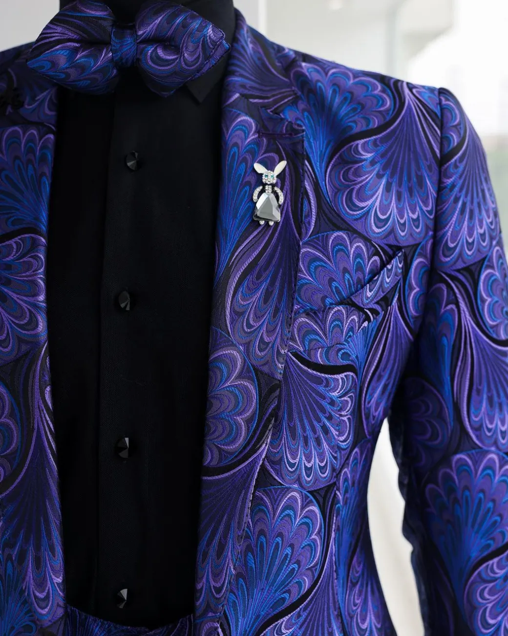 A Purple, black & slash of blue petal pattern, notch lapel suit