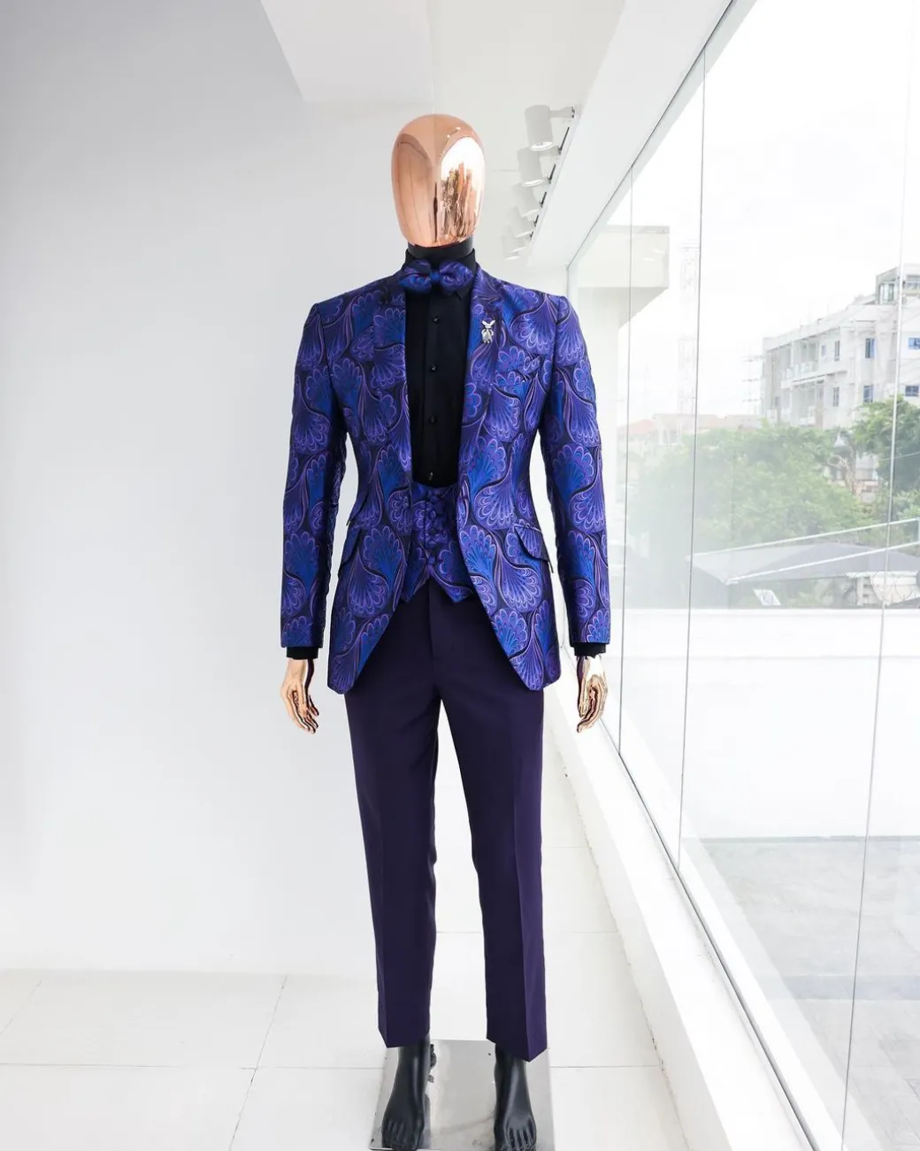 A Purple, black & slash of blue petal pattern, notch lapel suit
