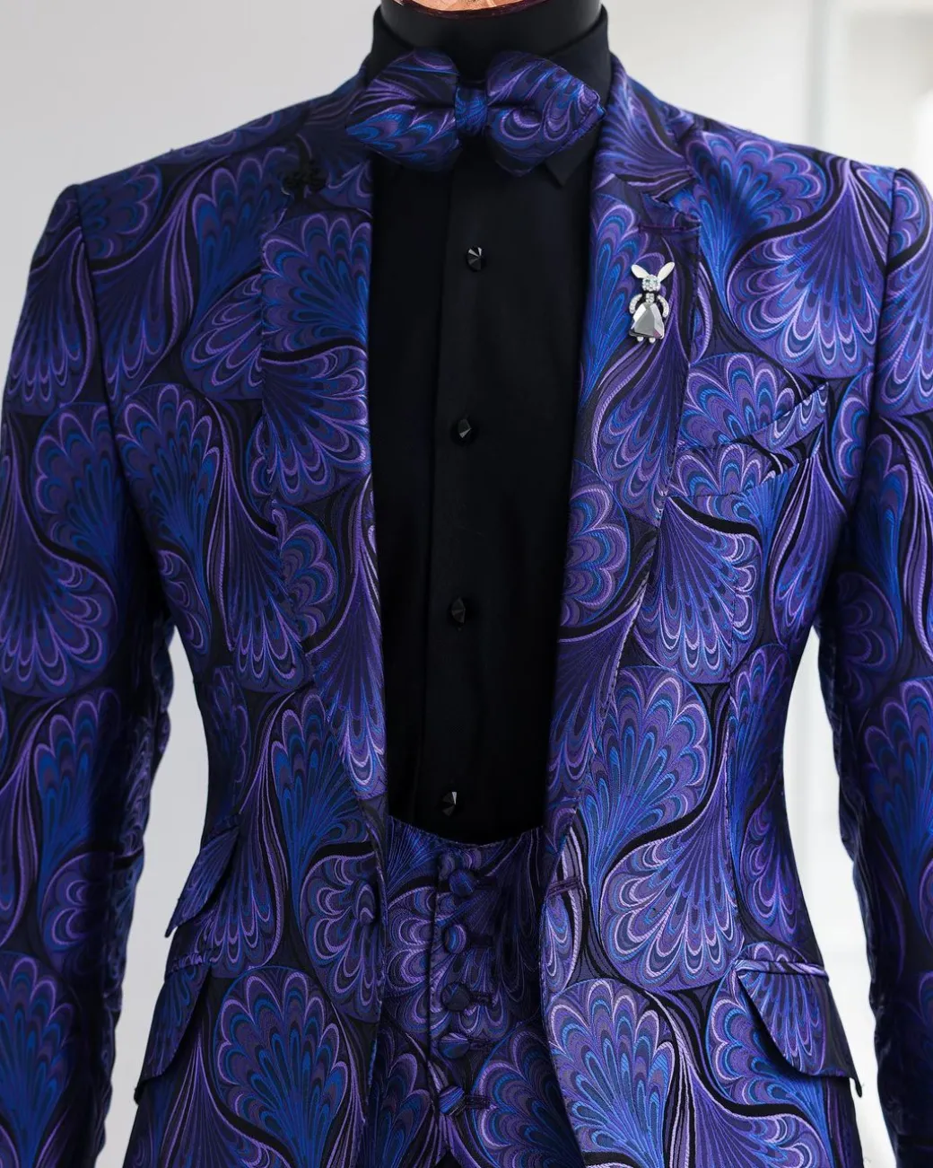 A Purple, black & slash of blue petal pattern, notch lapel suit