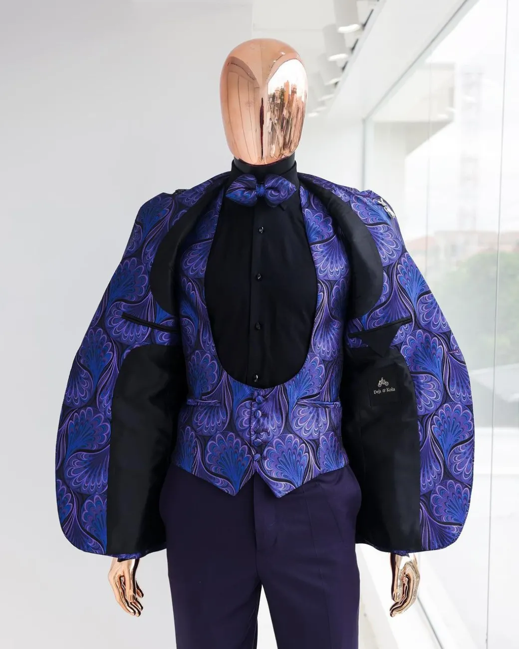 A Purple, black & slash of blue petal pattern, notch lapel suit