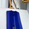 A related shade of blue rectangular front flap with clear view Swarovski button senator kaftan native