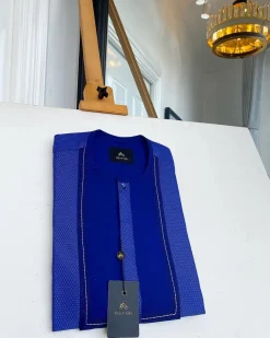 A related shade of blue rectangular front flap with clear view Swarovski button senator kaftan native