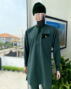 A reloaded British racing green, Monochrome embroidery with soaked Italian velvet detailing long sleeve Kaftan and sokoto