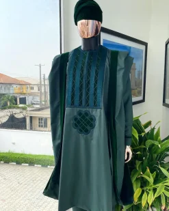 A reloaded British racing green Monochrome embroidery with soaked Italian velvet detailing agbada