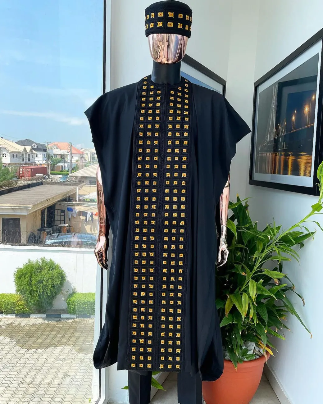 A Reloaded charcoal black, connected square embroidery design with matching gold and red Swarovski stone details agbada