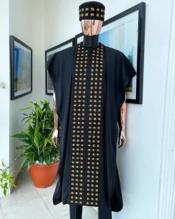 A Reloaded charcoal black, connected square embroidery design with matching gold and red Swarovski stone details agbada