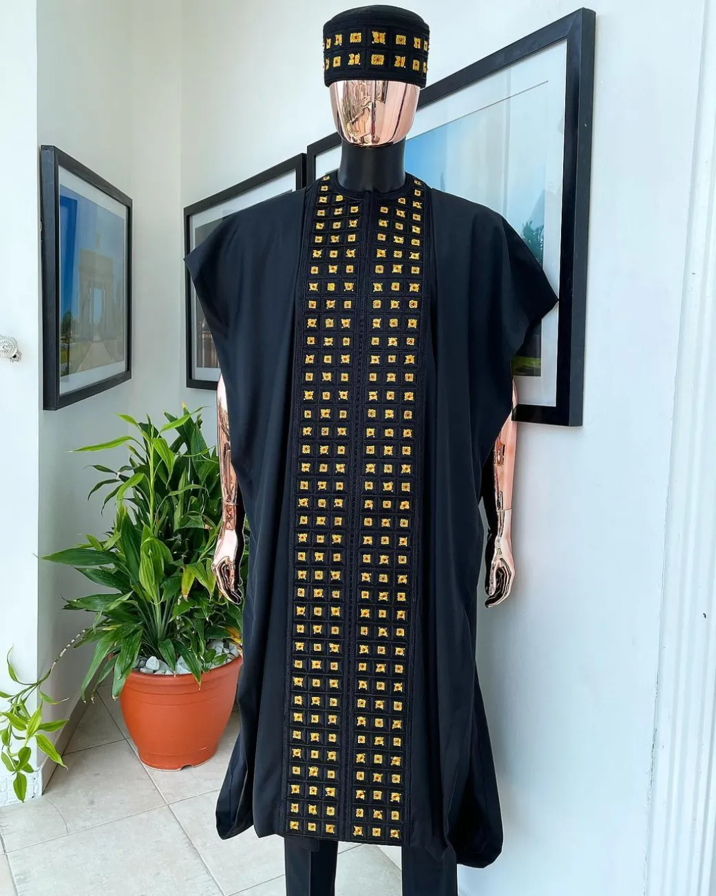A Reloaded charcoal black, connected square embroidery design with matching gold and red Swarovski stone details agbada
