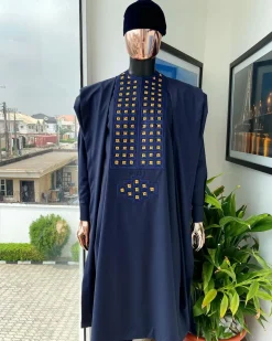 A reloaded midnight blue, connected square embroidery design with matching gold and red Swarovski stone details agbada