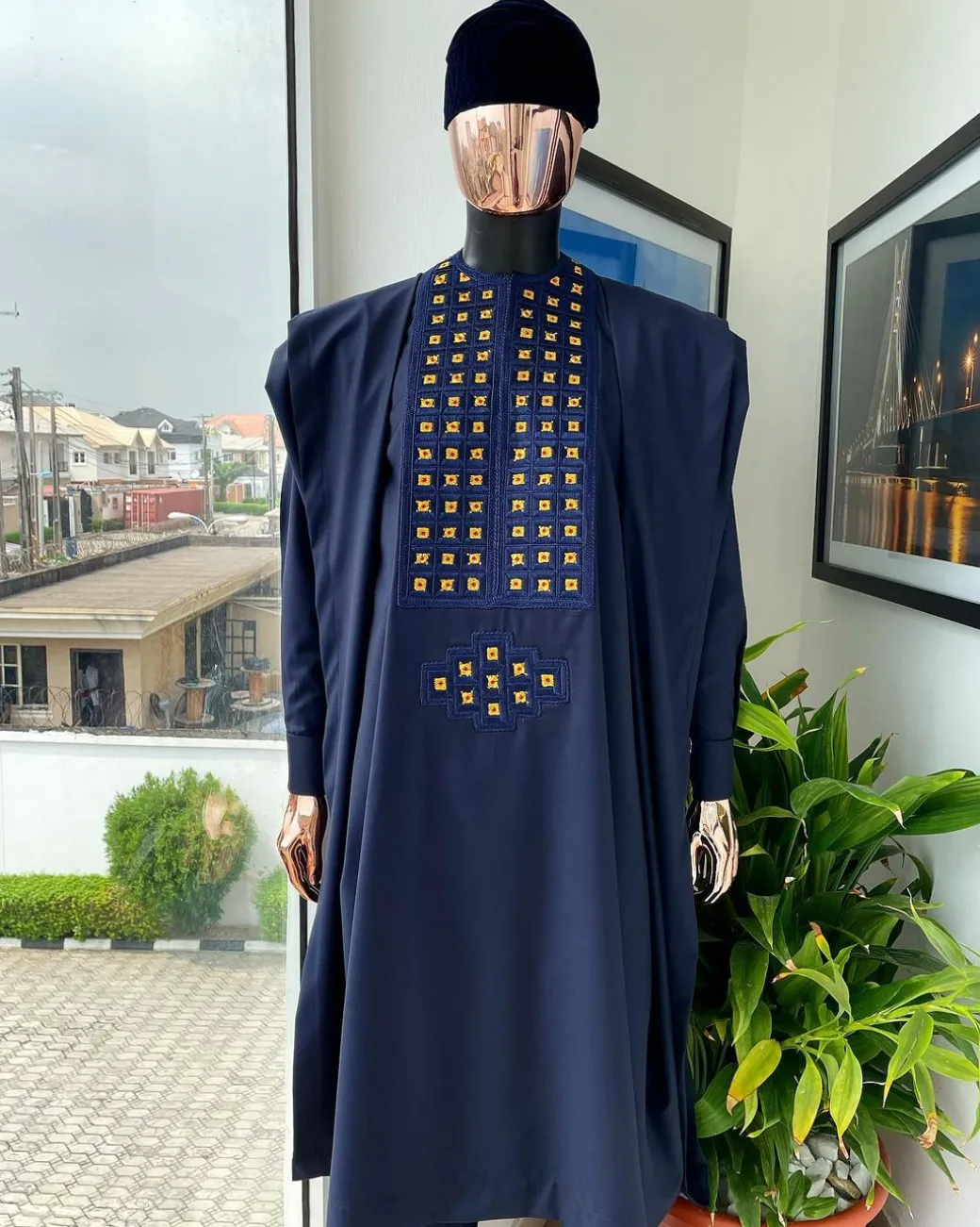A reloaded midnight blue, connected square embroidery design with matching gold and red Swarovski stone details agbada