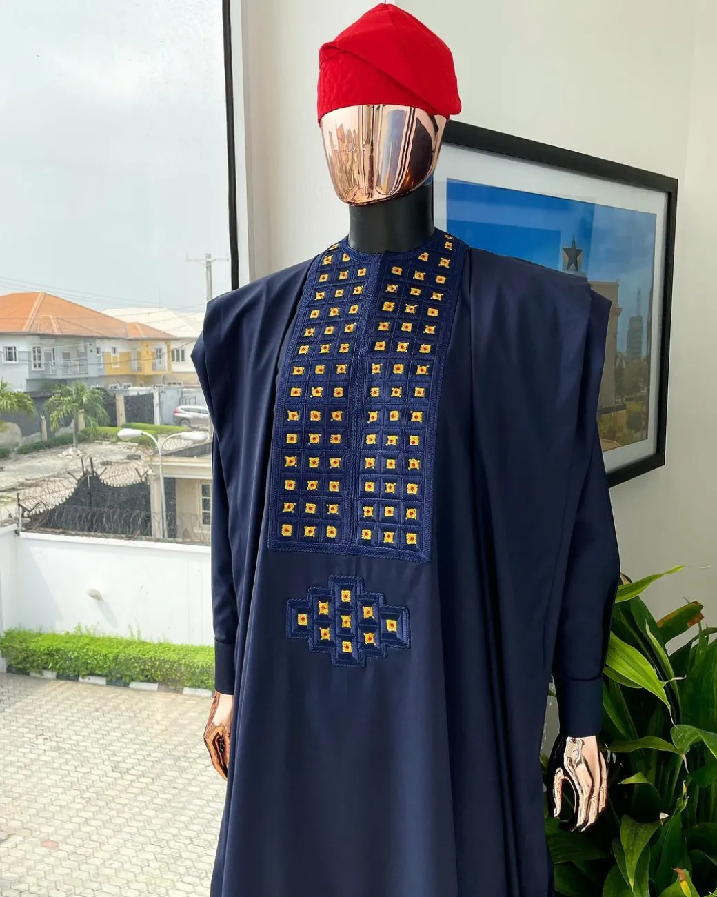 A reloaded midnight blue, connected square embroidery design with matching gold and red Swarovski stone details agbada