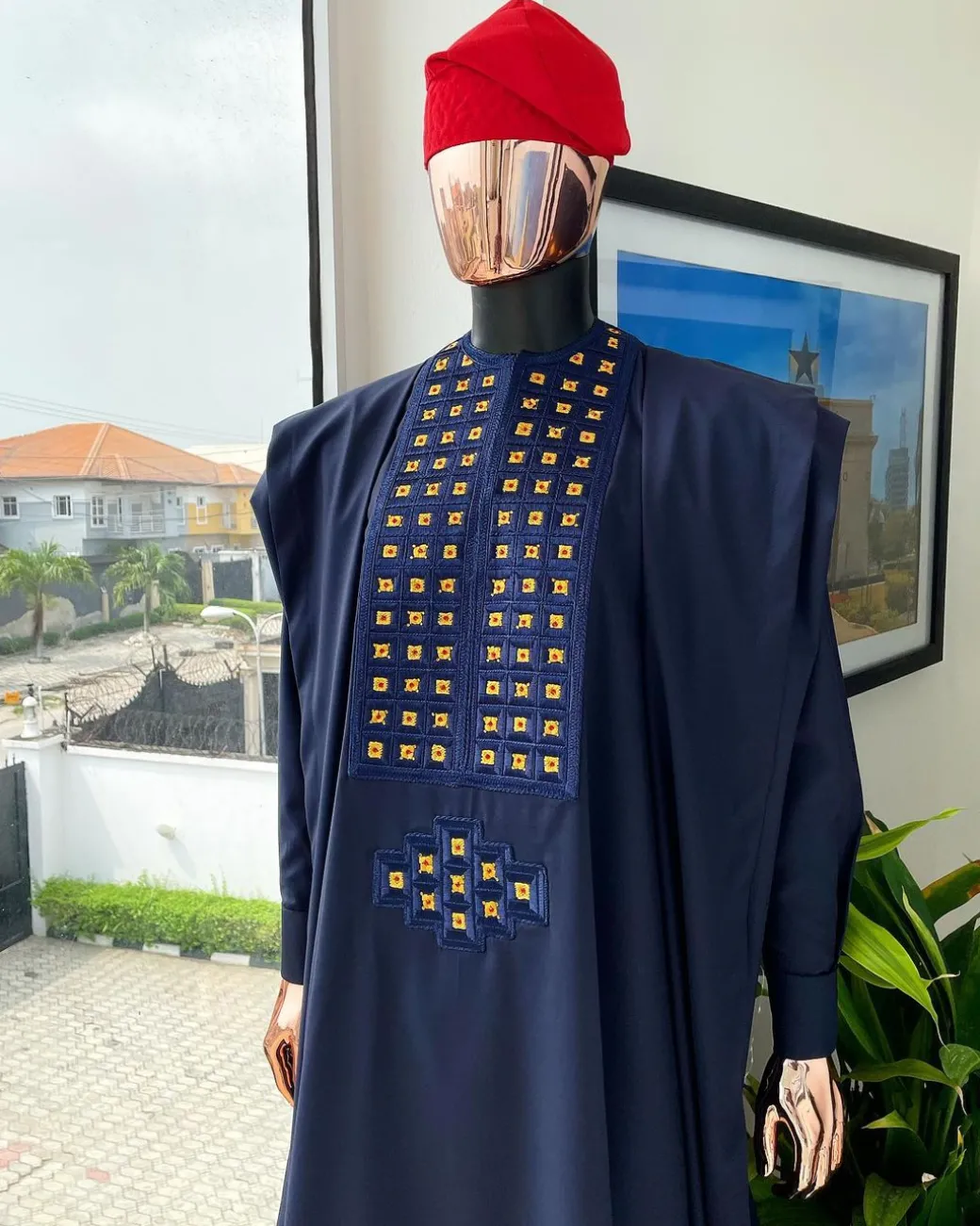 A reloaded midnight blue, connected square embroidery design with matching gold and red Swarovski stone details agbada