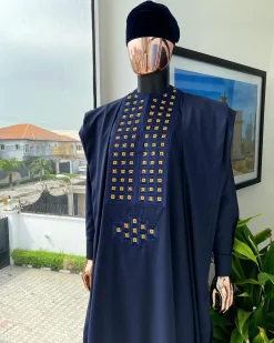 A reloaded midnight blue, connected square embroidery design with matching gold and red Swarovski stone details agbada