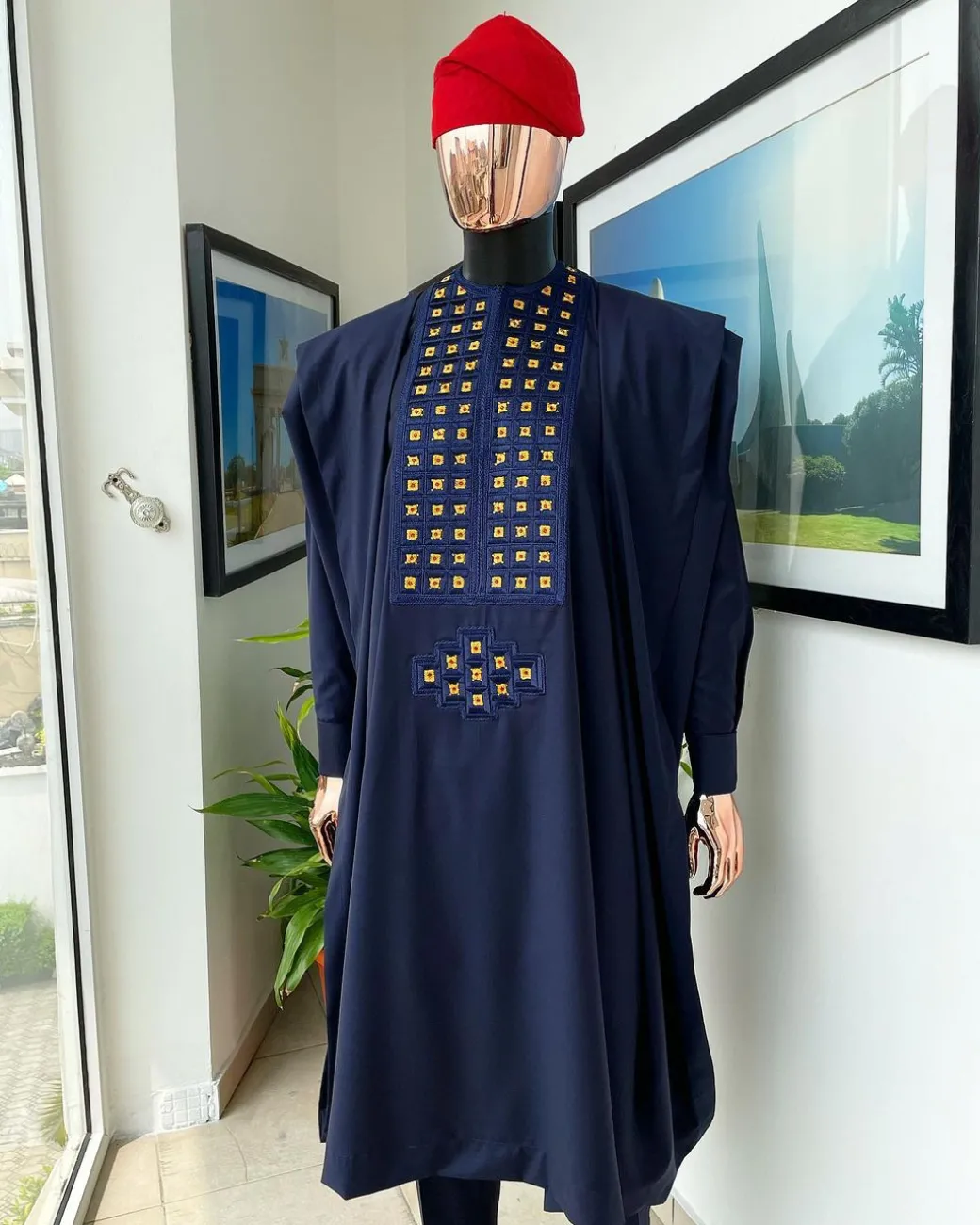A reloaded midnight blue, connected square embroidery design with matching gold and red Swarovski stone details agbada