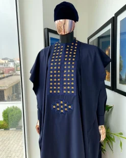 A reloaded midnight blue, connected square embroidery design with matching gold and red Swarovski stone details agbada