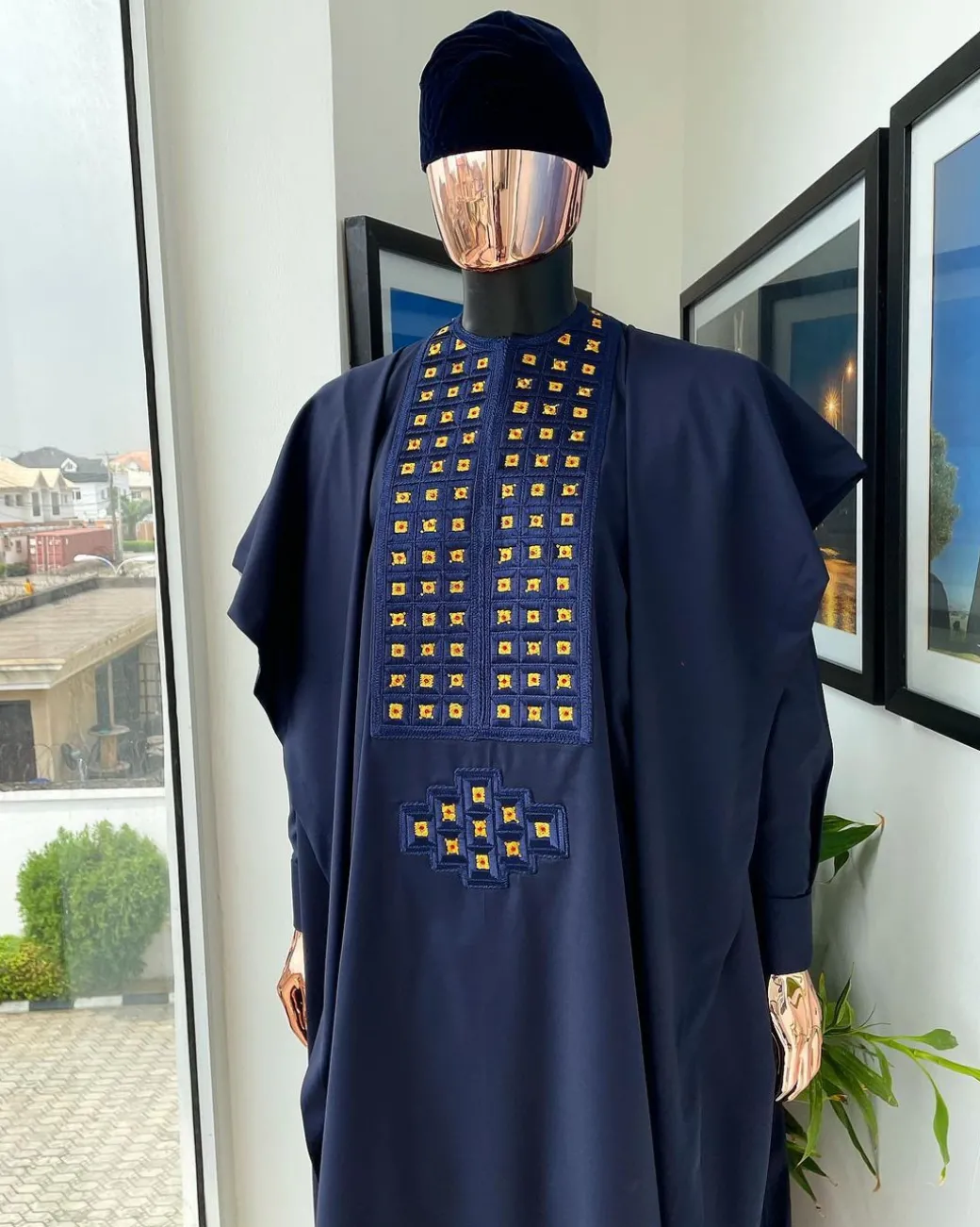 A reloaded midnight blue, connected square embroidery design with matching gold and red Swarovski stone details agbada