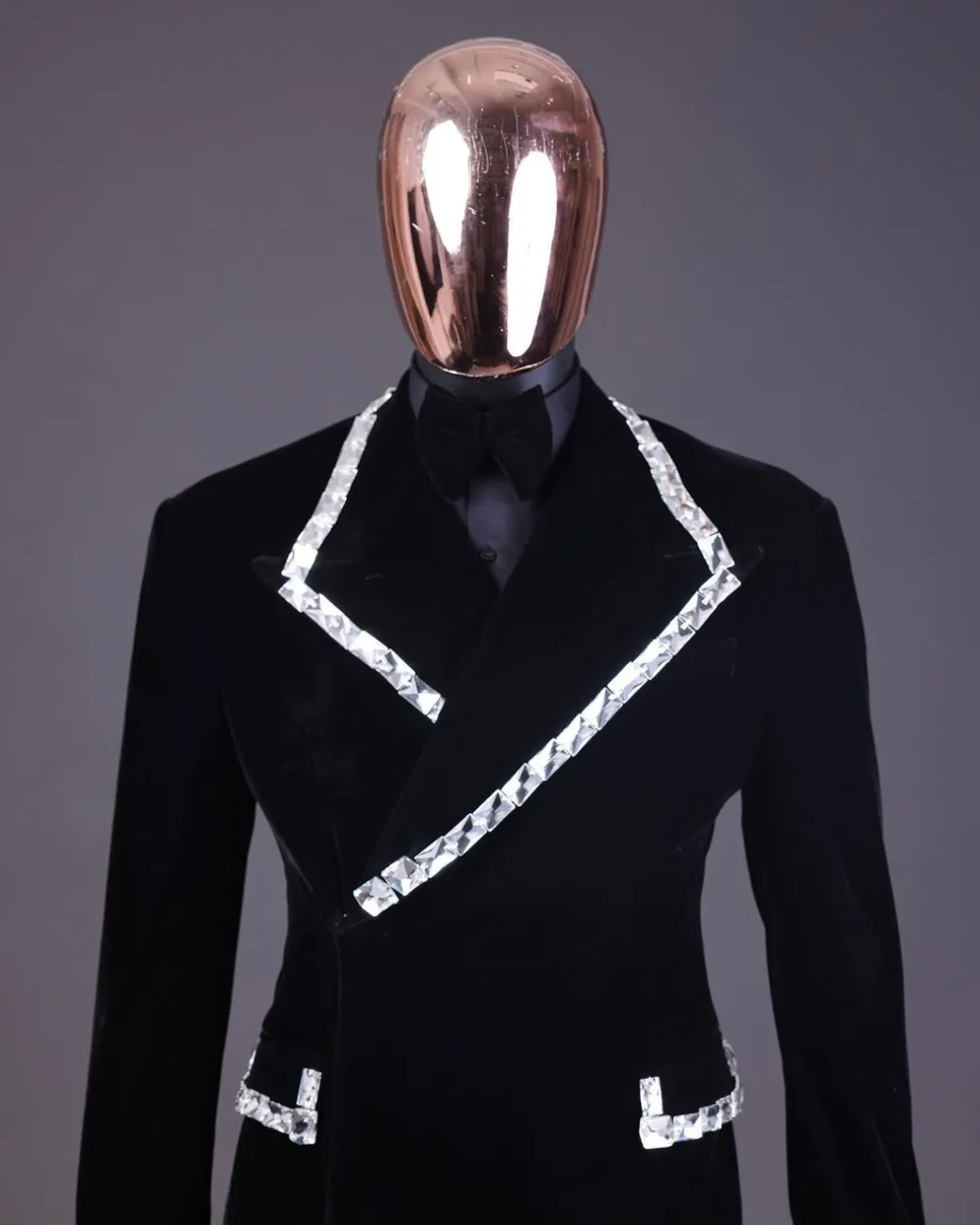 A reloaded monochrome “herd” charcoal black soaked velvet peak lapel wrap tuxedo suit