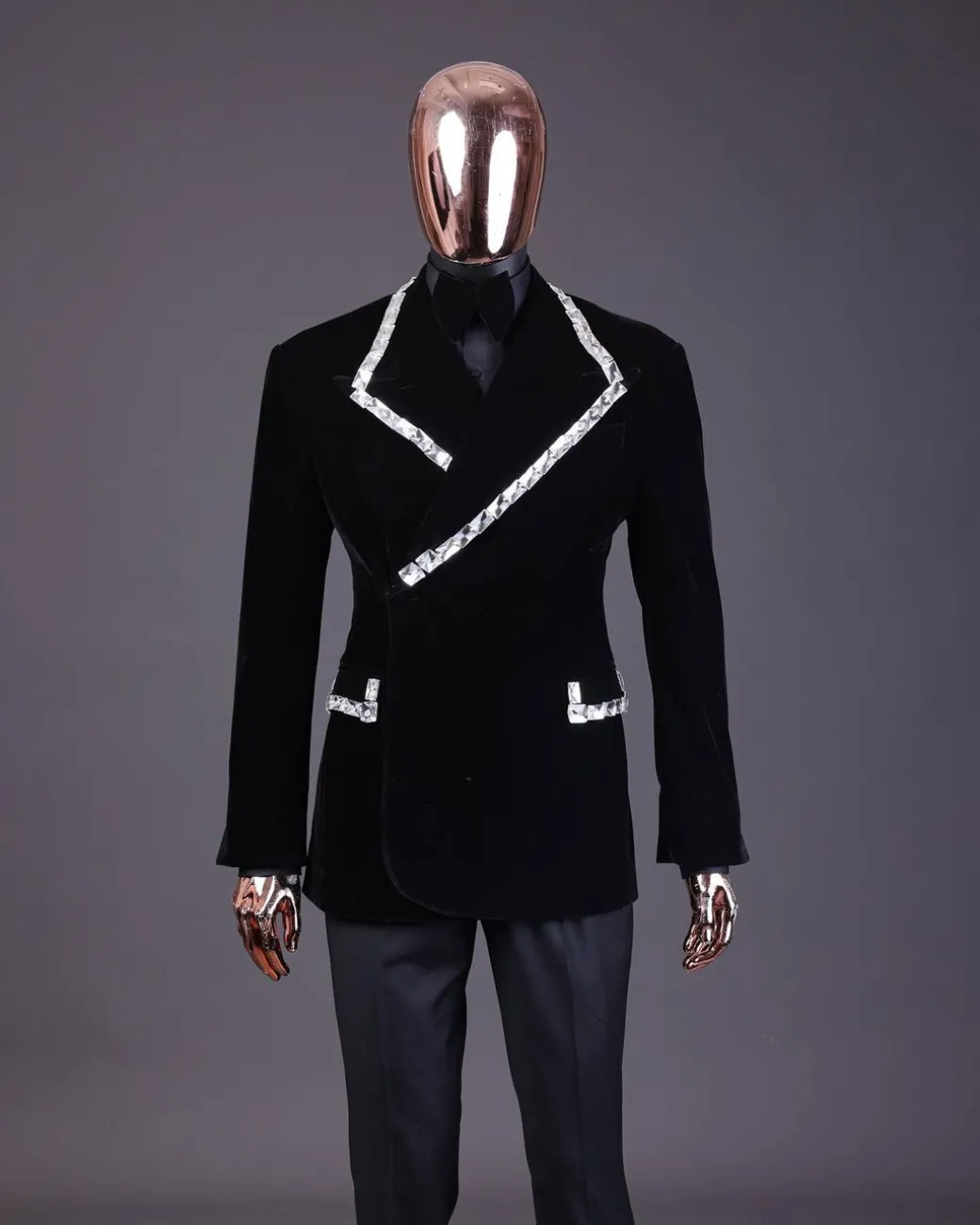A reloaded monochrome “herd” charcoal black soaked velvet peak lapel wrap tuxedo suit