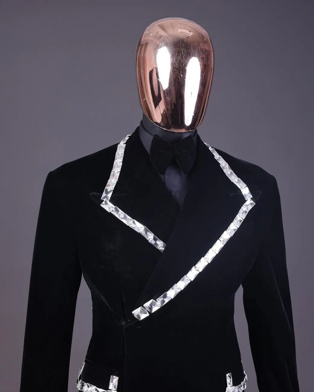 A reloaded monochrome “herd” charcoal black soaked velvet peak lapel wrap tuxedo suit