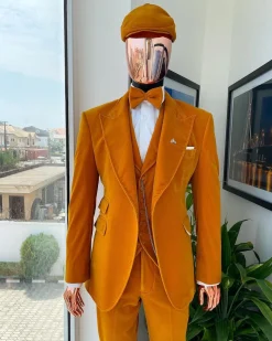 A reloaded monochrome “peaky blinders” hand knitted soaked Italian velvet ochre yellow peak lapel suit