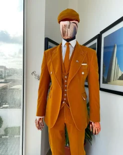 A reloaded monochrome “peaky blinders” hand knitted soaked Italian velvet ochre yellow peak lapel suit