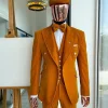 A reloaded monochrome “peaky blinders” hand knitted soaked Italian velvet ochre yellow peak lapel suit