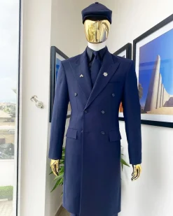 A reloaded monochrome “peaky Blinder” midnight blue peak lapel trench suit