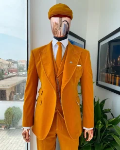 A reloaded monochrome “peaky blinders” hand knitted soaked Italian velvet ochre yellow peak lapel suit