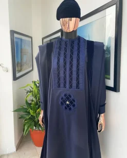 A Reloaded navy blue Monochrome embrodery with soaked Italian velvet detailing agbada