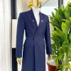 A reloaded “peaky Blinder” midnight blue peak lapel trench suit