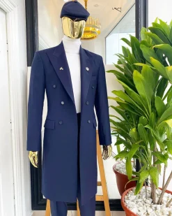 A reloaded “peaky Blinder” midnight blue peak lapel trench suit