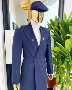 A reloaded “peaky Blinder” midnight blue peak lapel trench suit