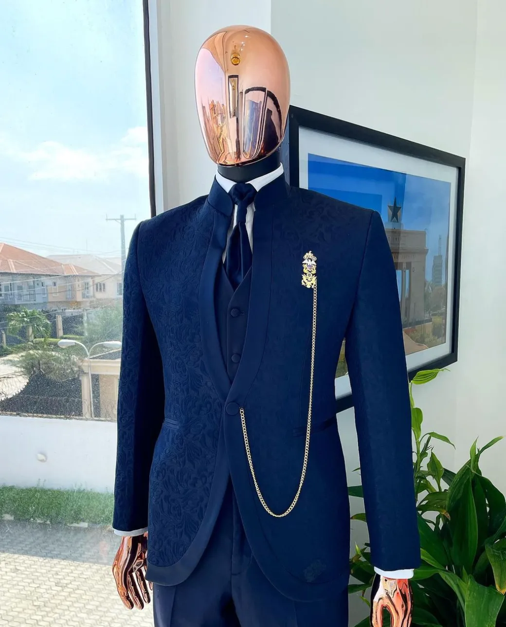 A Reloaded “Pope” navy blue single button bishop neck suit