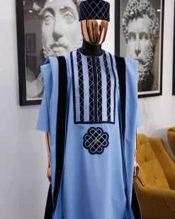 A Reloaded sky blue Monochrome embroidery with navy blue soaked Italian velvet detailing agbada