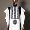 A Reloaded white Monochrome embroidery with charcoal black soaked Italian velvet detailing agbada