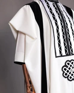 A Reloaded white Monochrome embroidery with charcoal black soaked Italian velvet detailing agbada