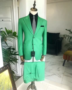 A “Rich Green” peak lapel, “hand knitted” patch pocket Suit