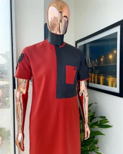 A Rosso corsa red, half cut black paisley detailing with mandarin knot button detailing african traditional senator kaftan native