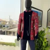 A Royal Navy blue, white and red splashed Mandarin Jacquard safari tuxedo royal suit