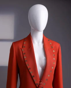 A rust orange peak lapel with shades of brown ss16 Swarovski stone details double-breasted jacket.
