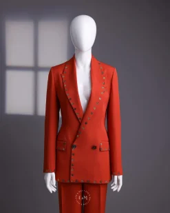 A rust orange peak lapel with shades of brown ss16 Swarovski stone details double-breasted jacket.