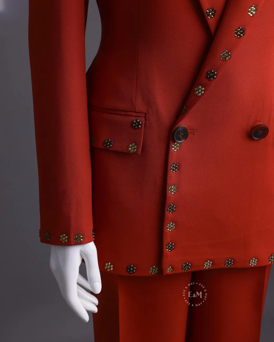 A rust orange peak lapel with shades of brown ss16 Swarovski stone details double-breasted jacket.