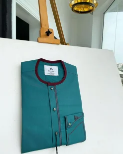 A Sacramento green, burgundy detailing, mixed-colour button details African traditional senator Kaftan native