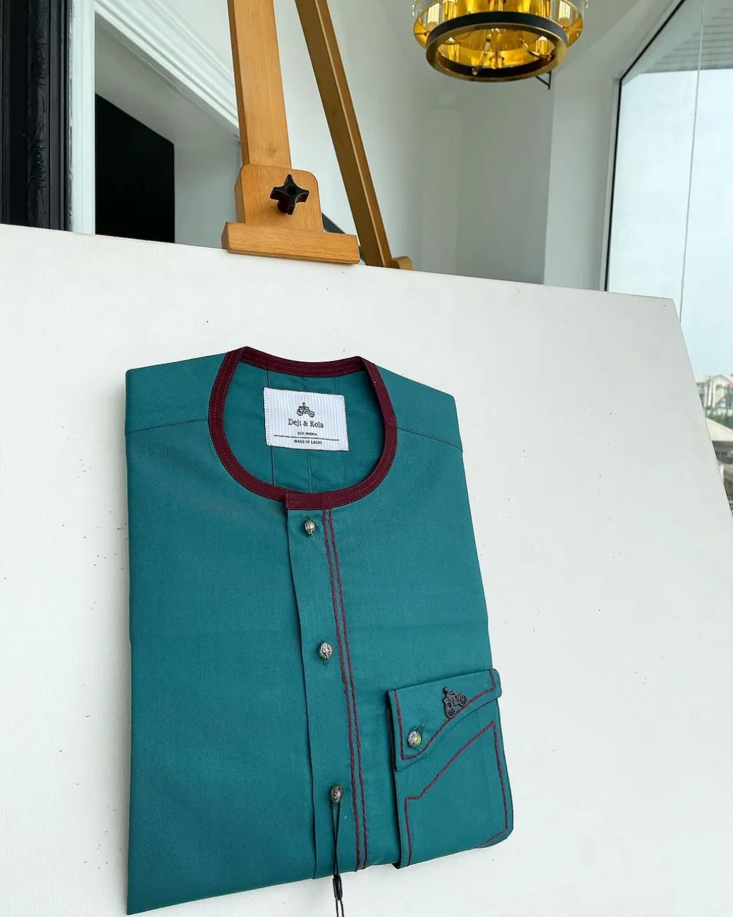 A Sacramento green, burgundy detailing, mixed-colour button details African traditional senator Kaftan native