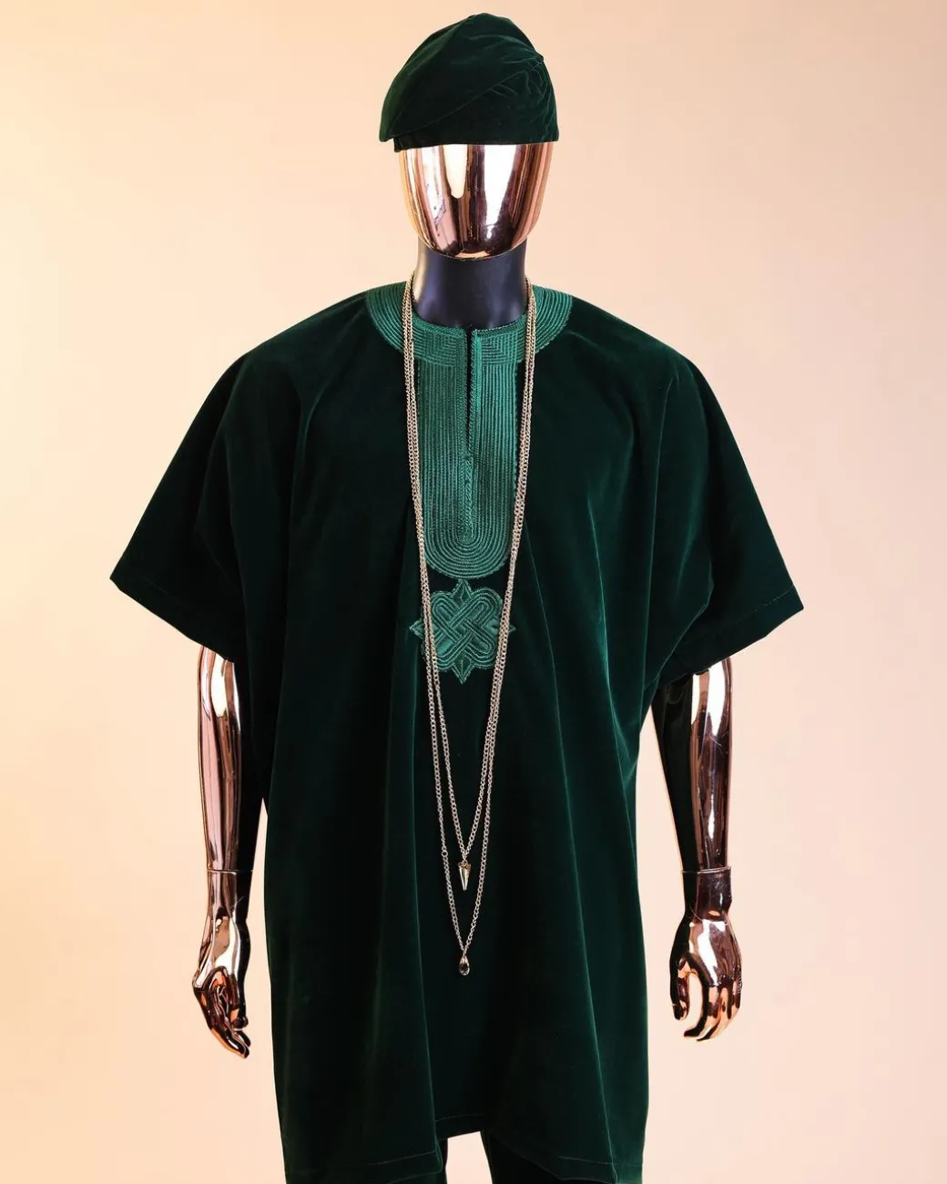 A Sacramento green daftan, sokoto & Fila Yoruba African native.