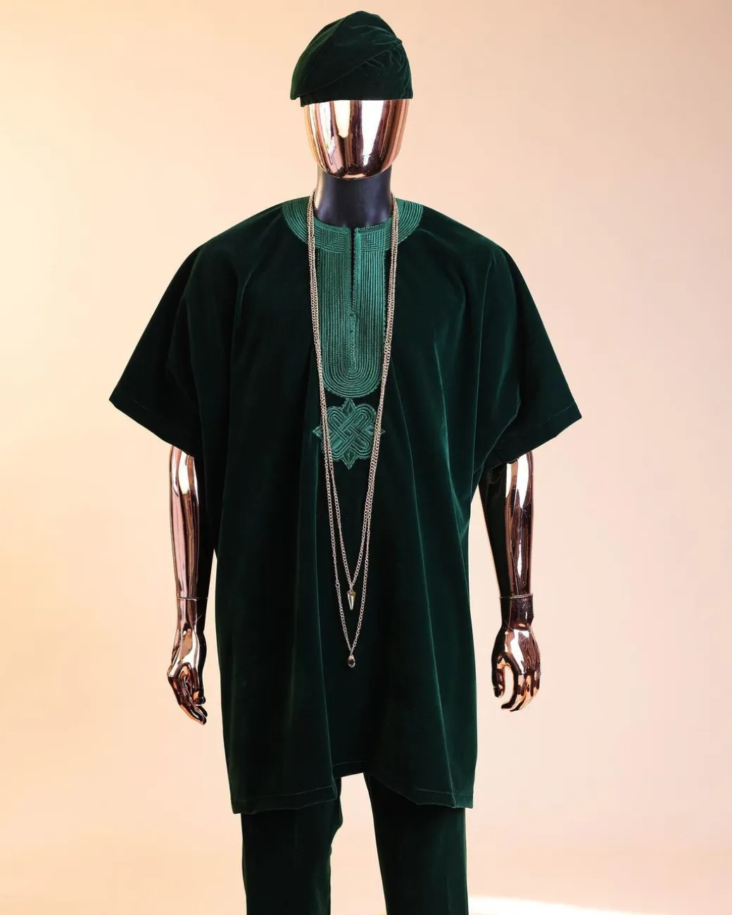 A Sacramento green daftan, sokoto & Fila Yoruba African native.