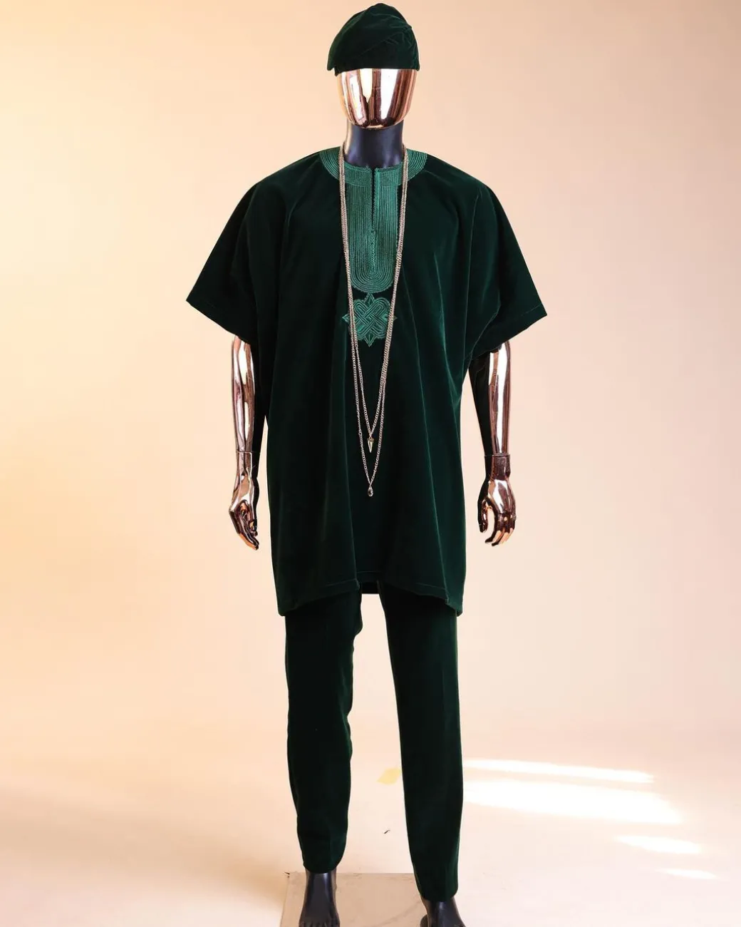 A Sacramento green daftan, sokoto & Fila Yoruba African native.